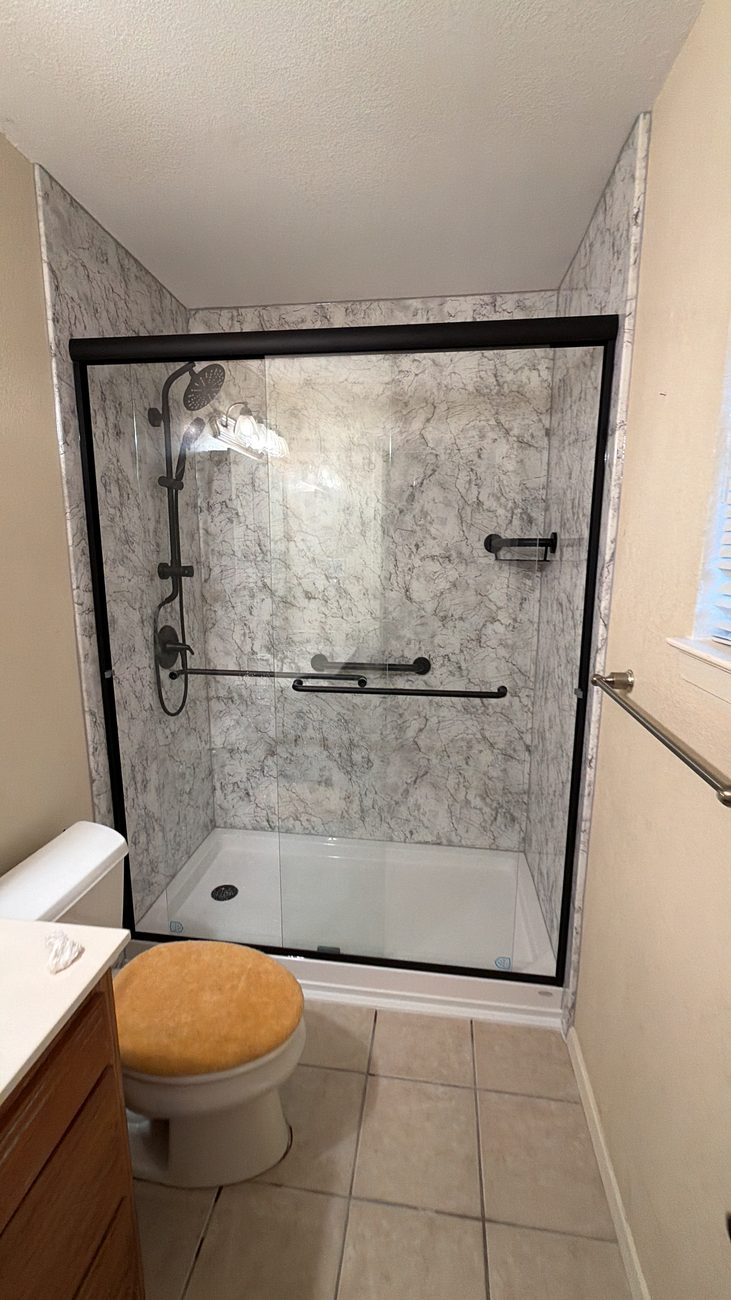 Walk-in marble-look acrylic shower